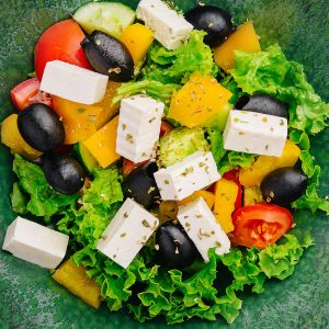 Greek salad with feta, avocado and black olives