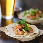 mexican shrimp tacos with avocado and beer